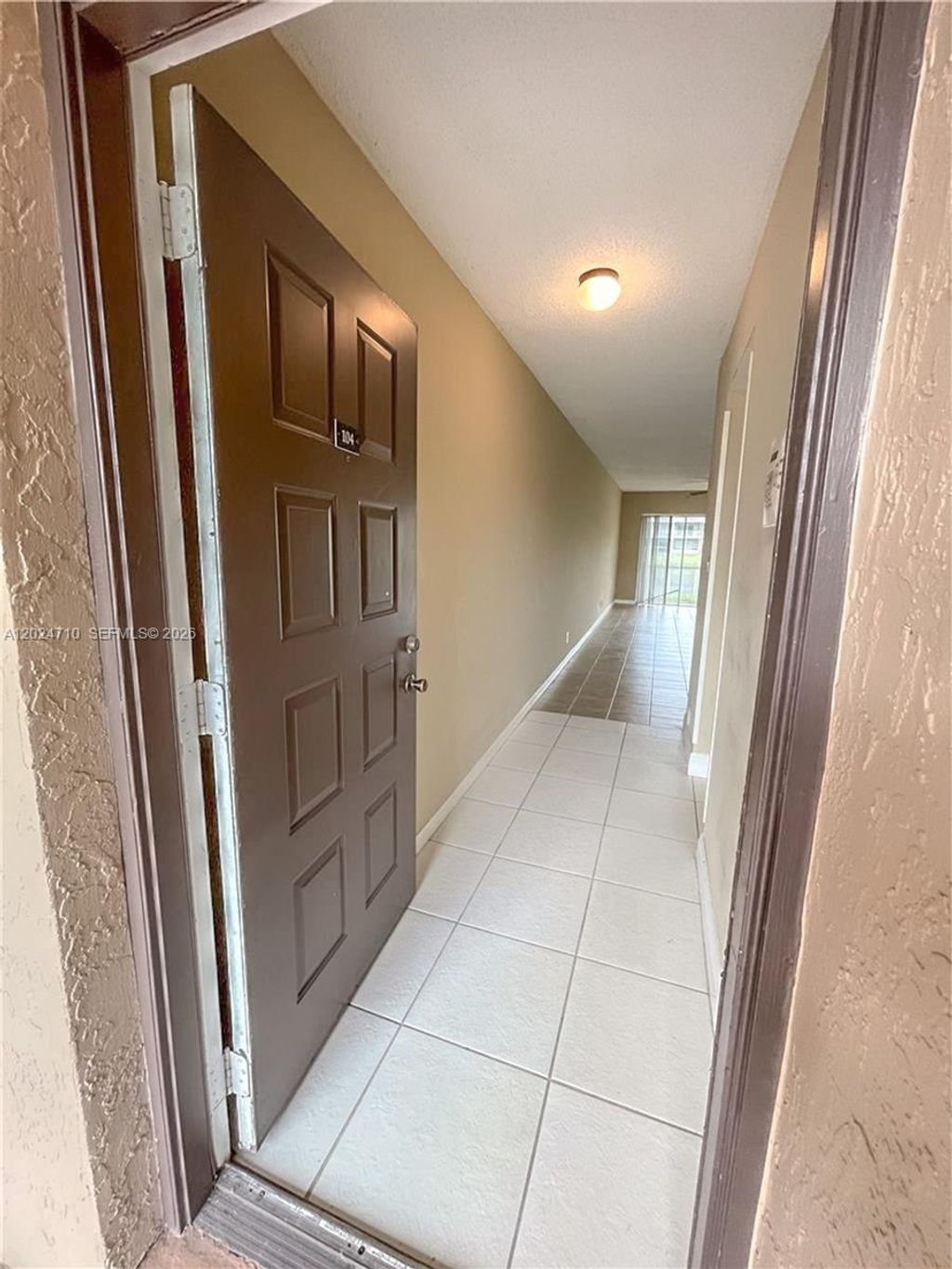 Photo of 2829 N Course Dr #104, Pompano Beach, FL 33069 (MLS # A12024710)