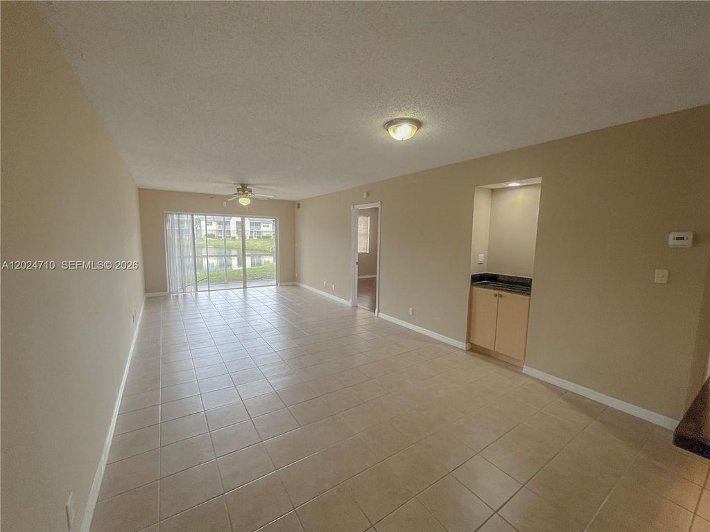 Photo of 2829 N Course Dr #104, Pompano Beach, FL 33069 (MLS # A12024710)