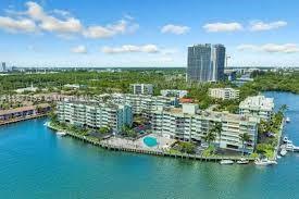 Beautiful and impressive view! All areas and rooms have a water view. 2 bedrooms and 2 bathrooms, fully renovated, on a corner, with 1260 square feet in the exclusive gated community of Eastern Shores. Open design with two entrances to the kitchen, offering serene views of the boats and water. The west exposure fills the space with natural light from beautiful sunsets. Residents enjoy resort-style amenities including a pool, gym, tennis courts, sauna/spa, BBQ/picnic areas, and boat dock access. Additional conveniences include an elevator and laundry facilities. Prime location just minutes from Sunny Isles Beach, Aventura Mall, Oleta River State Park, restaurants, shops, and highways. Close to highly-rated schools.