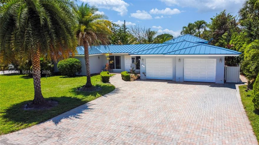 BRAND NEW DESIGNER METAL ROOF!!
Welcome to the sought-after community of Coral Shores, where luxury waterfront living meets everyday comfort.
This stunning residence has one of the most breathtaking views in the neighborhood, offering expansive wide-water views and 75 feet of prime waterfrontage. Inside, you’ll find two spacious main suites, each designed with comfort in mind. The remodeled kitchen is a chef’s dream and ready for entertaining. The massive master suite is a true retreat, featuring 12-foot tray ceilings, dual walk-in closets a custom A/C system, and all IMPACT windows and doors! Step outside to your dock, where you can launch a kayak, go boating, or simply enjoy the tranquil beauty of the water.The pool has an upgraded salt water system.This home perfectly combines coastal charm with modern luxury. (Also available for LEASE $9500 per month))