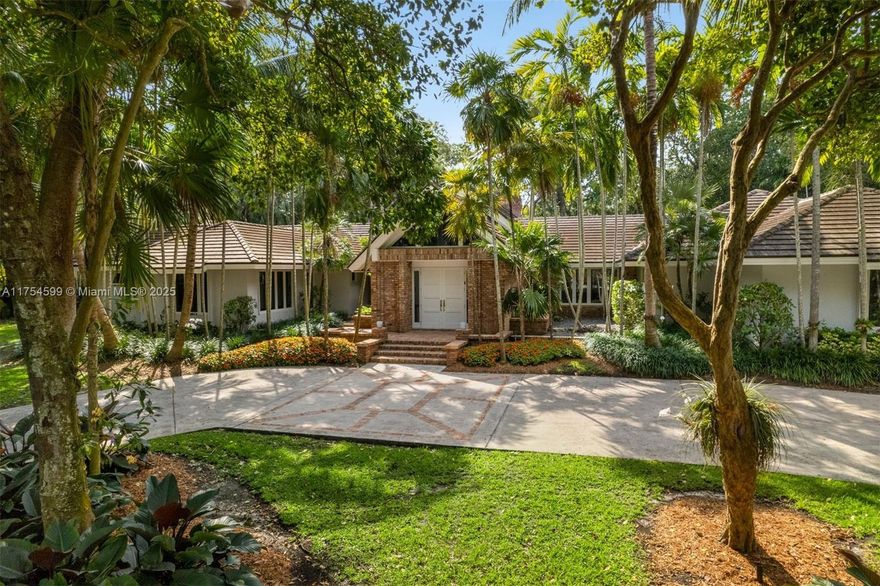 A rare gem in one of Coral Gables’ most prestigious neighborhoods, this estate is situated on approximately 2.5 acres within the exclusive gated community of Gables Estates. This single-story residence boasts over 6,700 sq. feet and is the ideal home for a family.The property combines beautifully landscaped gardens with a natural Florida hammock, (with over 200 trees) that offer exceptional beauty and privacy, making it a perfect haven for entertainment.Ideally located near the best private schools in Miami, 10-minute drive to the University of Miami and 20 minutes from Miami International Airport.
The back acre of the property is protected as part of the natural forest community and benefits from special tax considerations due to its abundant specimens of Florida's unique flora and fauna