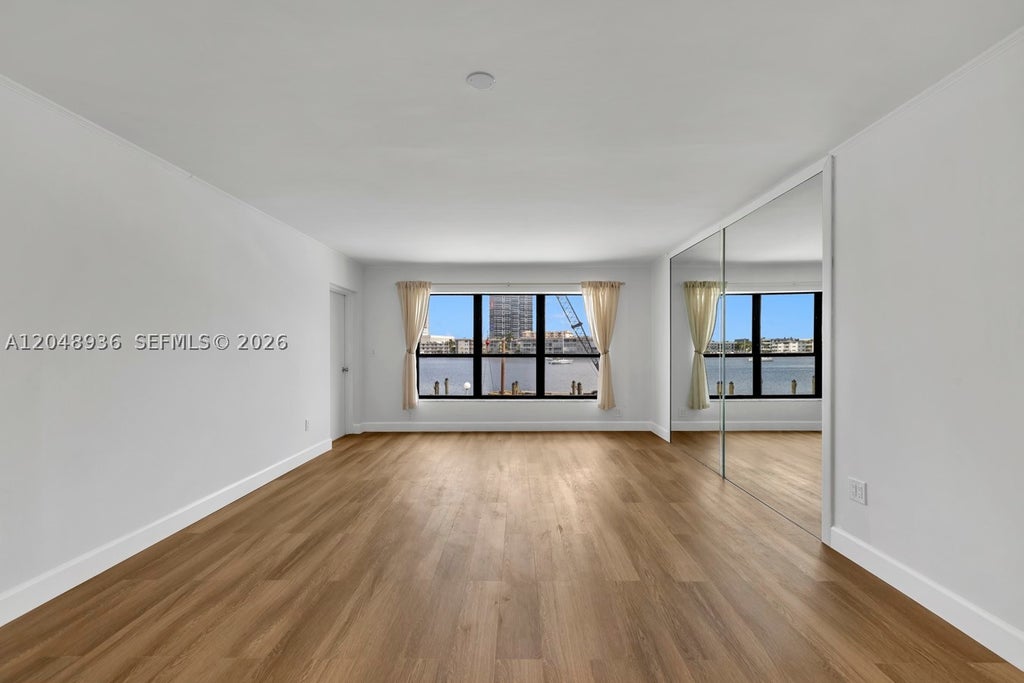 Photo of 200 Golden Isles Dr #203, Hallandale Beach, FL 33009 (MLS # A12048936)