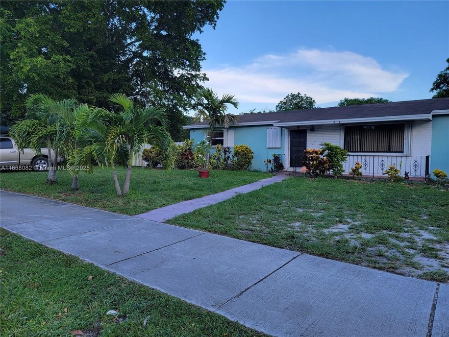 Spectacular property with great potential due to its location in a rapidly expanding area, close to restaurants, shopping, and educational institutions. The total area is 12,500 sq ft, easy access via I95. The roof is less than 10 years old, and accordion-style hurricane shutters are installed on all windows. Split bedroom layout with 3 spacious bedrooms and 2 full bathrooms on one side. The fourth separate bedroom measures 14x10 and has a full bathroom. The master bathroom is recently renovated. Tiles are installed in the main areas and new flooring is provided in the bedrooms. Bright and spacious living room, laundry room, and a large 31x10 covered and screened back porch, in addition to a front porch. Large fenced backyard with fruit trees.