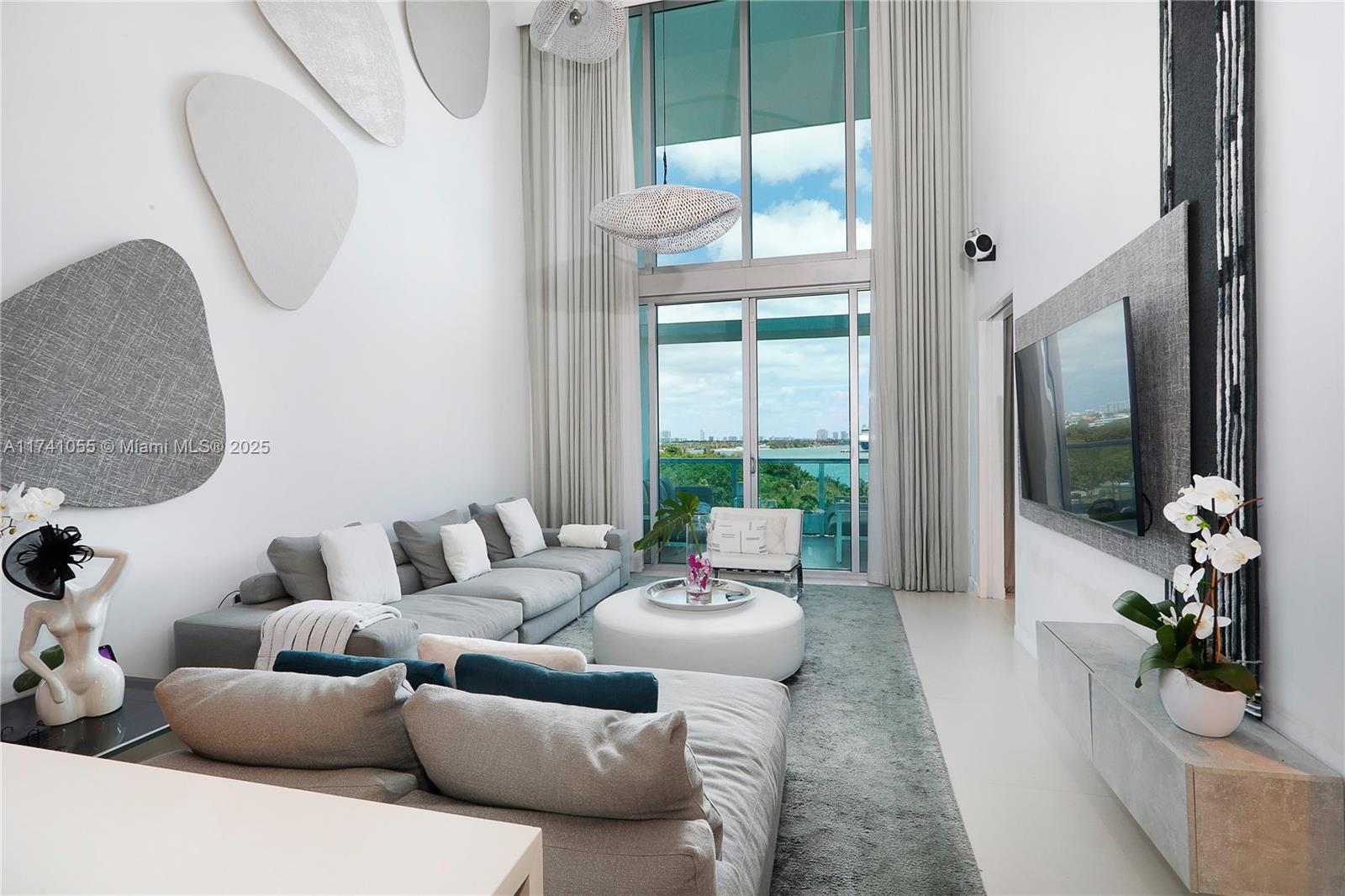 Experience unparalleled luxury living in exquisite 2-level unit with direct water view. Boasting 3bed/3bath this contemporary marvel features open-concept floor plan that seamlessly connects kitchen-living-dining, all while offering breathtaking water views. Each of 3bedrs is private suite with lavish baths & walk-in closets. Indulge in custom luxury finishes & furnishings: incld chef's kitchen outfitted with top-of-the-line appliances/cabinetry. 2primary suites, 1 on each floor, offer spacious balconies with uninterrupted vistas. This ultra-luxury building provides amenities:concierge, valet, fitness, pool, spa, sauna, & more. Located in prime area brimming with cultural attractions, incld museums, AA Arena, Arsht Center, renowned restaurants, shops, and parks, all within easy reach.