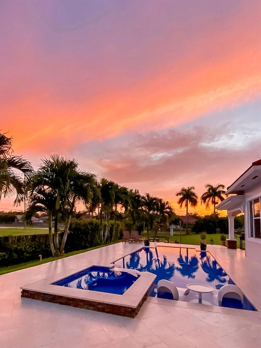 Welcome to this impeccably renovated single-family home on a corner lot on over an acre of land with 6303 sqft of living space. The expansive foyer welcomes you with its sweeping staircase and soaring vaulted ceilings. The heart of this home is the gourmet kitchen adjacent to a spacious family room with a magnificent fireplace. The first floor offers a split plan giving the master bedroom total privacy, an office/den, 2 bedrooms with Jack & Jill bathroom, a media room with full bath which can be in-law quarters. Upstairs there are 2 rooms with full baths and a large loft with a balcony overlooking the breathtaking renovated heated salt water pool! This homes has 4 Acs , 3 car garage plus golf cart parking, Tesla charging station in the garage, impact windows and doors and Roof 2010.