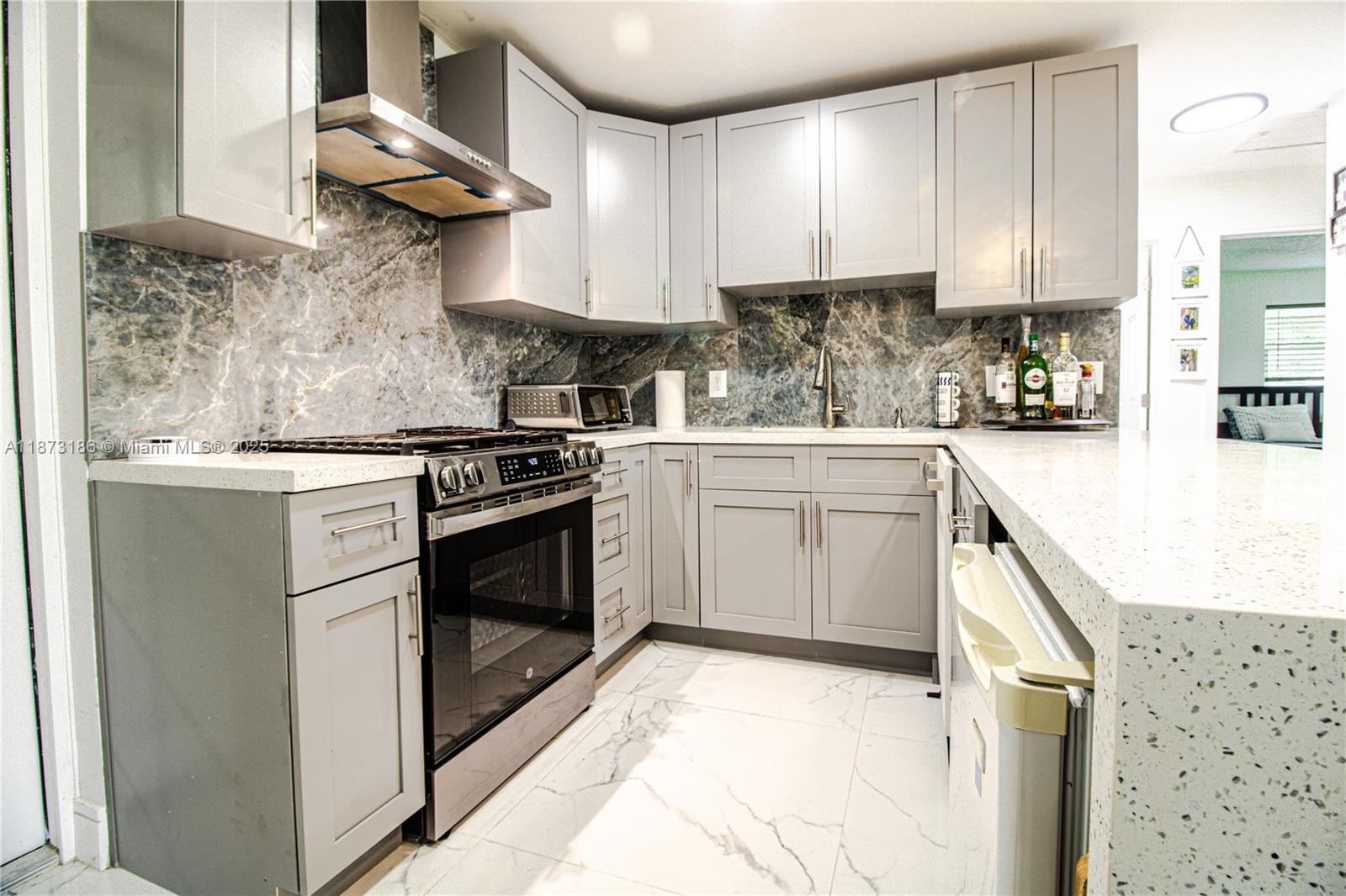 This beautifully remodeled house in Davie home also includes a private maid/in-law quarters—perfect for guests, home office, or rental income. Fully updated with a 1-year-old roof, impact windows, brand-new A/C, gas water heater, and new stainless-steel appliances including a gas range. Modern chef’s kitchen with quartz waterfall island, sleek porcelain floors, and open living spaces. Fenced backyard patio ideal for entertaining.