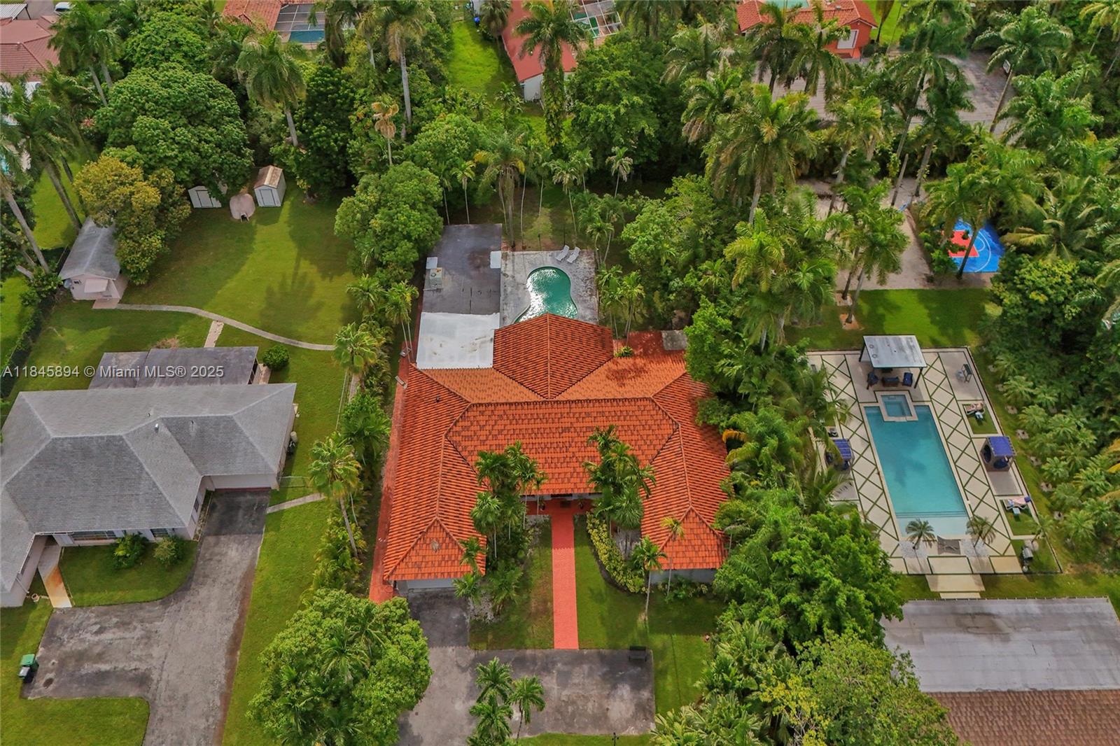 Stunning 4BD and 3.5BA estate on a massive 33,297 sqft lot! This fully remodeled 4,262 sqft POOL HOME features impact windows, state-of-the-art finishes, a chef’s kitchen, luxurious bathrooms, and elegant design throughout. A large additional room with its own bathroom offers endless possibilities—ideal as a guest suite, outdoor kitchen, gym, or more. The property includes a 2-car garage plus a spacious driveway that fits over 12 vehicles. Expansive outdoor areas are perfect for entertaining or relaxing. Prime location near I-95, Miami Shores, Design District, Wynwood. A rare turnkey opportunity with nearly an acre of land in the heart of Miami.