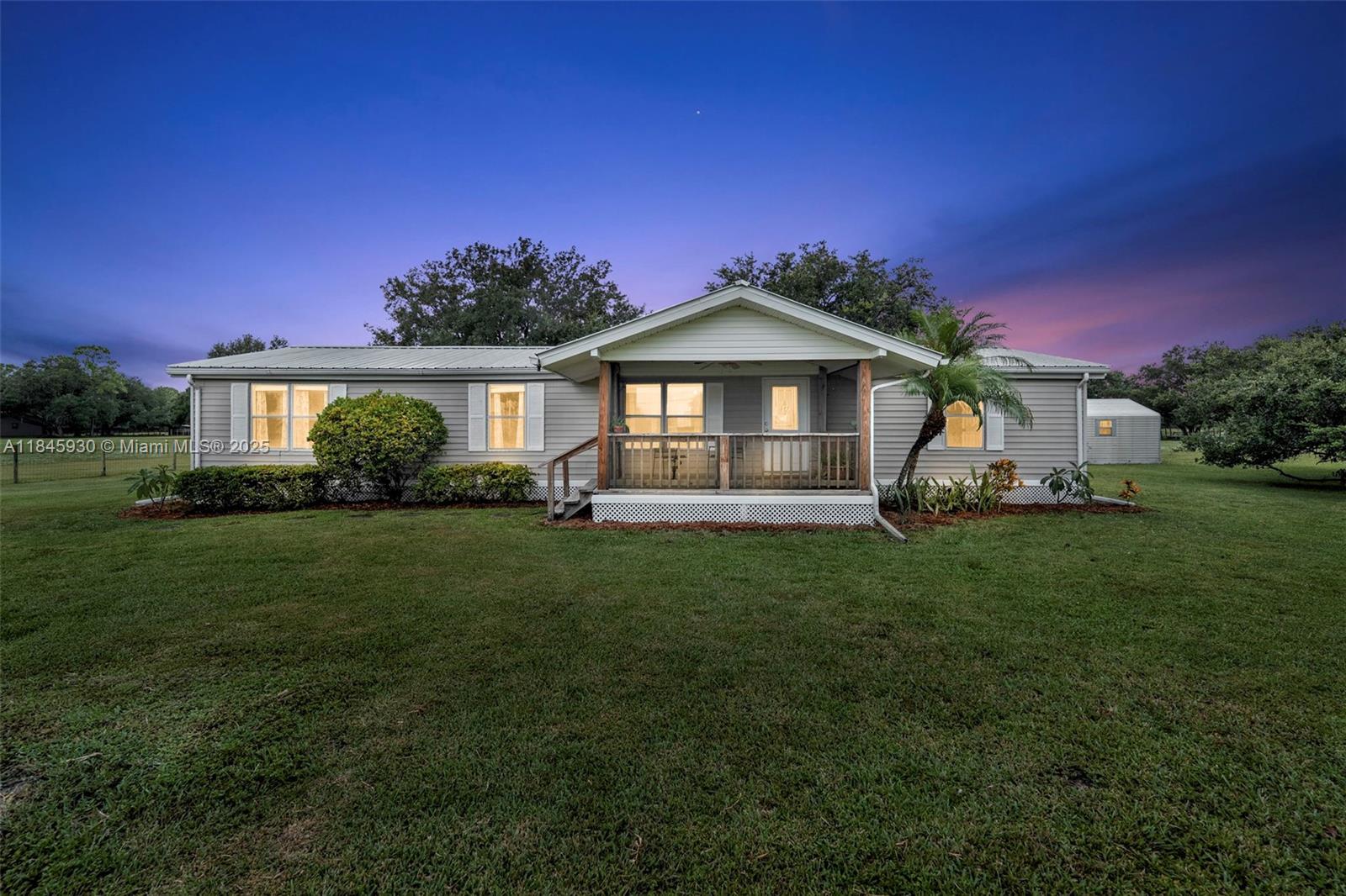 Set on over 10 sprawling acres, this 4-bedroom, 3-bath property offers a rare opportunity to own a piece of peaceful countryside in one of LaBelle’s most desirable rural settings. Surrounded by mature oak trees and wide-open pasture, this mostly cleared land provides space, privacy, and flexibility for a variety of lifestyles—from hobby farming and equestrian use to simply enjoying the serenity of nature. The home itself is a spacious and functional mobile residence with an open porch, ideal for quiet mornings or evenings spent soaking in the scenic surroundings. Inside, the layout accommodates comfortable living with four bedrooms, making it a great option for families, multi-generational living, or those needing flexible space for a home office or guest rooms.