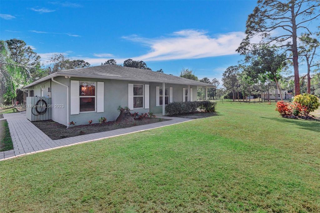 Photo of 14718 N 85th Rd N, Loxahatchee, FL 33470 (MLS # A11345360)