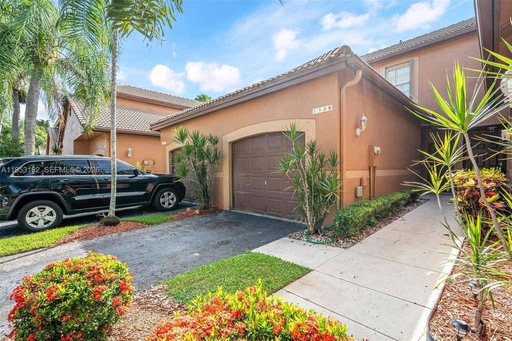 Photo of 1528 Veracruz Ln #4-3, Weston, FL 33327 (MLS # A11953162)