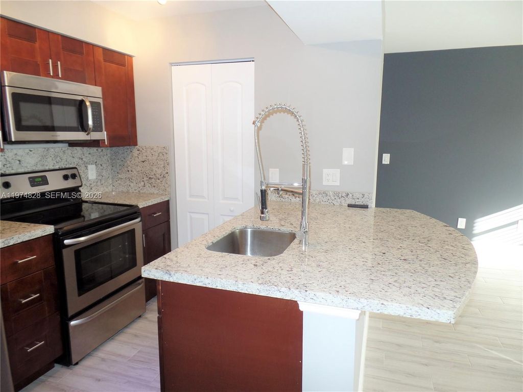 Photo of 1239 SW 46th Ave #908, Pompano Beach, FL 33069 (MLS # A11974828)