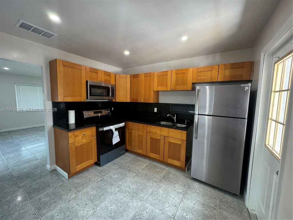 Photo of 6322 Eaton St #1-2, Hollywood, FL 33024 (MLS # A11978639)