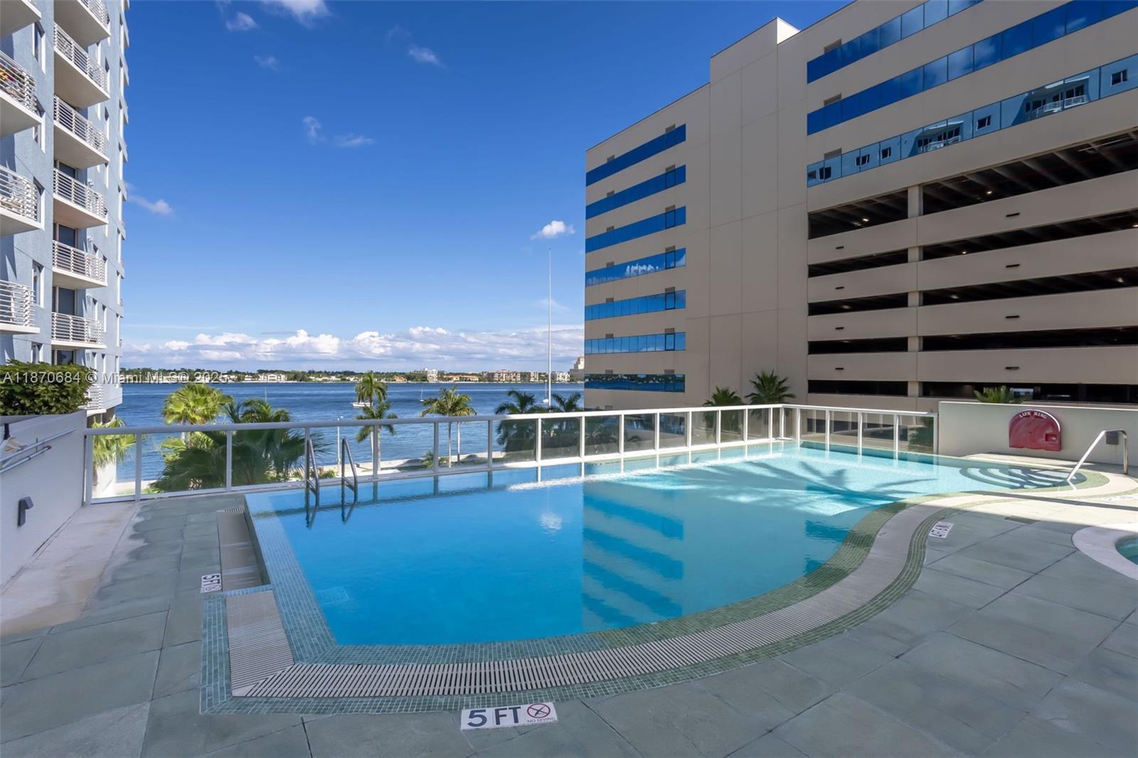 BEAUTIFULLY MAINTAINED & UPSCALE BUILDING - THE SLADE! This tropical, urban, gorgeous condo is located just a few blocks from downtown in the heart of the “hot-spot” near restaurants, pubs, boutique shops, and only minutes from the beach. This bright & airy unit comes with all NEWER SS appliances in kitchen and a NEWER washer/dryer. There are two resort-style pool & spa areas on the 5th floor inside this lush landscape community, a decor-styled clubhouse & modern fitness center, business center, and a sauna. Front desk concierge, security & valet. Locked and gated assigned garage parking. Optional - Fully furnished with upscale furniture. It's like being in a fine hotel.