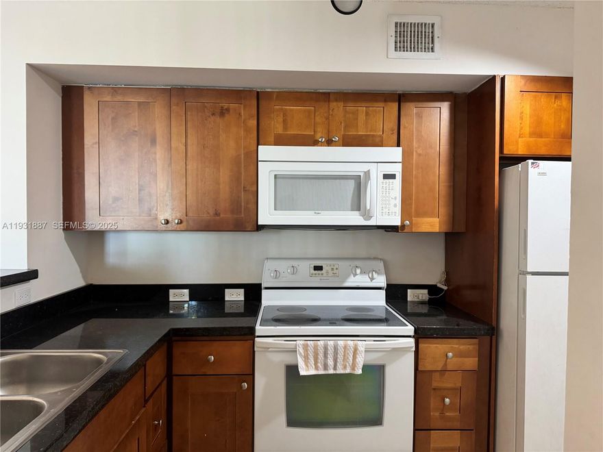 Priced to rent fast!! Beautiful 2BR/2BA Condo in Devonaire – Prime Pembroke Pines Location! Welcome to this charming 2-bedroom, 2-bathroom condo located on the first floor in the sought-after Devonaire community, right in the heart of Pembroke Pines. This well-maintained unit features stylish laminate flooring throughout, a spacious open layout, and large bedrooms with walk-in closets for ample storage. Enjoy the convenience of an in-unit washer and dryer, and unwind on your private balcony with stunning views of the tranquil garden. Community amenities include a refreshing pool and kids’ playground—perfect for families. Unbeatable location just steps from Pembroke Lakes Mall, fine dining, shopping centers, hospitals, and major highways. Zoned for excellent schools and close to public transportation. Best unit in the complex at this price!!