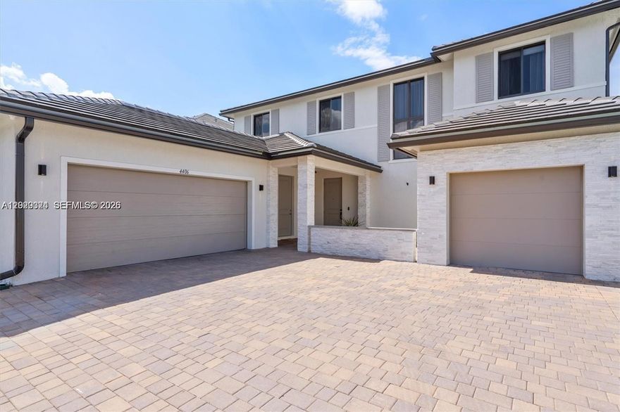 Located in the gated Marbella Miramar community, this spacious two-story home offers over 4,000 sq. ft. of comfortable living with thoughtful upgrades throughout. The home features porcelain tile on the first floor, laminate flooring upstairs, a 3-car garage with polyurea flooring, and a large driveway with space for up to 8 vehicles. The kitchen is designed for everyday use and entertaining, with granite countertops, stainless steel appliances, and a generous pantry. Downstairs, there is a flexible room with its own full bathroom, currently used as a gym, but ideal as a bedroom, office, or guest suite. Upstairs, the primary suite includes a large walk-in closet and a well-appointed bathroom with dual vanities, a soaking tub, and a separate shower. Two additional bedrooms, full bathrooms with showers, and an open office area that can be converted into a large bedroom complete the second floor. The exterior adds even more appeal with a marble facade, modern lighting, and video security. A great opportunity to own a beautifully upgraded home in one of Miramar’s desirable gated communities.