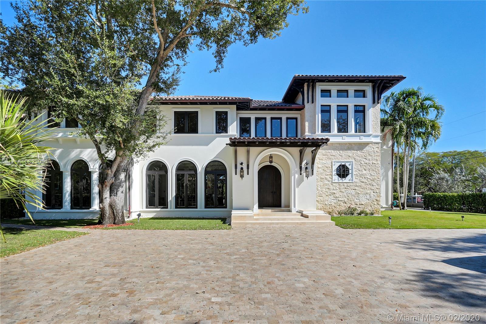 Spectacular North Pinecrest property. This Luxurious 2-story compound is situated on a nice street within minutes of A+rated public and private schools. The home is bathed in light and offers gracious living spaces, high ceilings, a stunning modern open kitchen including the latest state of the art appliances, generous walk-in closets, and spacious bathrooms, inside and outside Sonos sound system, impact doors and windows throughout, and so much more. The guest house and live-in quarters can be accessed separately or through the second floor. The beautifully landscaped outside is designed for entertaining and family-fun with an oversized pool, a clay tennis court, and an outdoor kitchen.