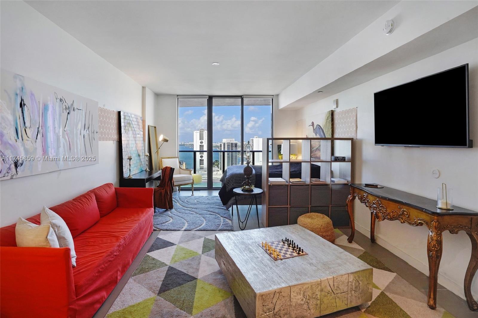 Stunning East Facing Studio Overlooking Biscayne Bay. Live the modern life in this spacious, fully furnished studio, which features some of the buildings most desirable and stunning panoramic views! Enjoy resort-style amenities, including three poolsone on the rooftop with unobstructed viewsand a well-equipped fitness center with a racquetball court. The building also offers dedicated coworking spaces and relaxing lounges. Located just two blocks from the Metrorail, with a charming cafe and restaurant on the ground floor, this apartment is perfect for those seeking convenience and style in a vibrant community.
