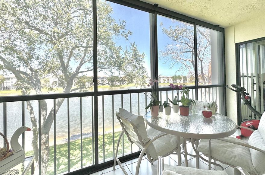 PRICE IMPROVEMENT! MOTIVATED SELLER! Welcome to Huntington Pointe with amenities galore! This unit has an updated kitchen, and a living room with screened-in patio overlooking the tranquil lake. Both bedrooms with adjoining bathrooms are beautifully updated as well. HOA includes alarm system, water, high speed internet, full access to club house, amenities and restaurants, 1 anssigned parking space and storage unit, and 24 hour guard gates entry. Come tour this incredible unit and wonderful community today! Newly renovated multi-million-dollar club house, theatre, tennis, gym, heated pools and 2024 New Roof - All assessments fully paid by seller!