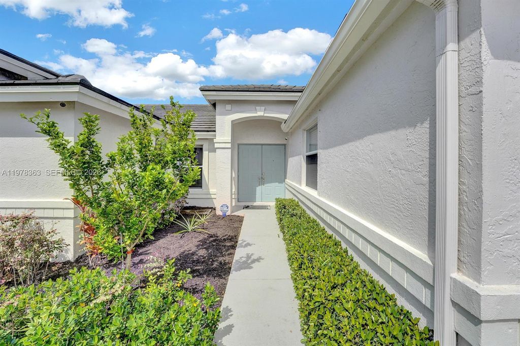 Photo of 3833 Cypress Lake Dr, Lake Worth, FL 33467 (MLS # A11978363)