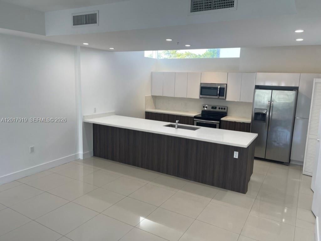 Photo of 1813 Madison St #6, Hollywood, FL 33020 (MLS # A12017919)