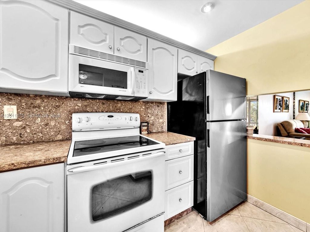Photo of 8465 Sunrise Lakes Blvd #212, Sunrise, FL 33322 (MLS # A12011475)