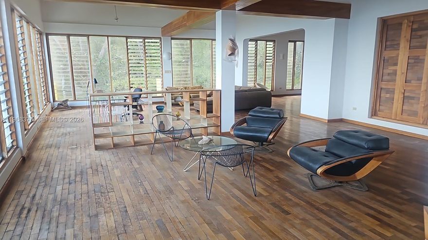 An extraordinary gated oceanfront compound inspired by GoldenEye in Oracabessa, this estate delivers unmatched features for elevated Caribbean living. Enjoy direct beach access, multiple residences for guests or staff, a resort-style swimming pool, summer kitchen, expansive outdoor entertaining areas, and potential for yacht dockage. The lush grounds are filled with mature fruit trees, dense tropical landscaping, and total privacy. Inside, discover handcrafted Jamaican furnishings and turnkey luxury throughout. With room to expand and endless ocean views from sunrise to sunset, this is a rare, fully equipped waterfront sanctuary built for living, hosting, and legacy ownership.