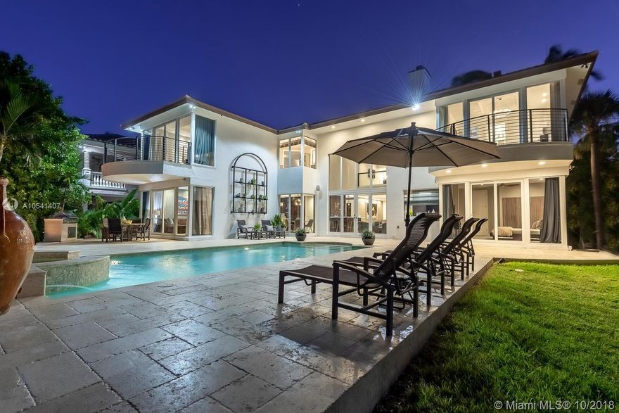 Located in coveted Seven Isles, this spectacularly renovated wide waterfront estate is finished with imported organic materials flowing effortlessly to create a distinctively designed vibe which transcends time.
Offering unparalleled & unobstructed Intracoastal and bay views, this artfully crafted oasis embodies luxury living.  Natural light flows through the floor to volume ceiling windows creating an ambiance second to none.  Inspired by the tranquil, majestic vista, the serene atmosphere & rich use of color and texture leave one to feel as if bathed in luxury.  Exquisitely designed onyx & leather bar, gourmet kitchen w/wolf gas stove & subzero appliances, sonos sound, separate spa his & her master baths, elevator, fire pit, spa pool, generator & sparkling water views from every room.