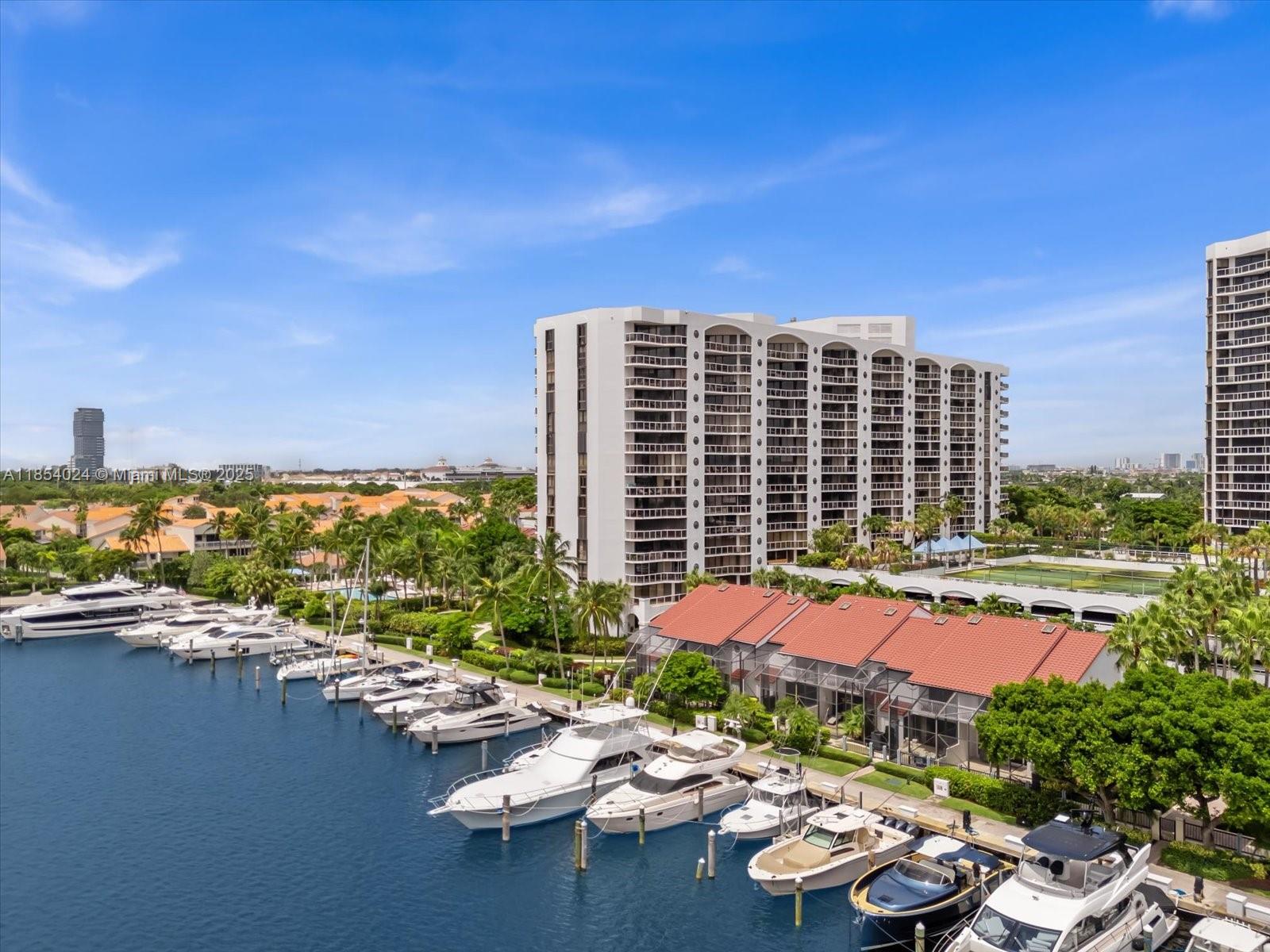 This beautiful 1,187 sq. ft. condo with two bedrooms and two baths offers unobstructed views from every room, overlooking the waterways marina and Gulfstream. Featuring hardwood floors in the living areas, carpeted bedrooms, and a spacious main suite with double vanities and a large walk-in closet. The kitchen includes stainless steel appliances, in-unit laundry, and extra storage. Highlights include resort-style amenities, including heated swimming pools on the marina, spa, sauna, tennis courts, a gym and it is a pet-friendly community. Conveniently located near restaurants and just minutes from the mall and beaches.