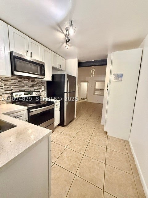 Photo of 1150 SW 26th Ave #1-2, Fort Lauderdale, FL 33312 (MLS # A12094829)