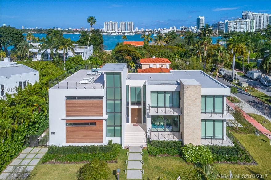 Finished in Dec 2015 by well known Architect Ralph Choeff. This  “statement property” is a 5 bedroom, 5 ½ bathroom residence with over 5,000 adjusted interior sq feet. This smart home features Lutron, motorized window treatments, heated pool, Generic Generator & Gas Modern Fireplace. Enjoy the elegant outdoor Cabana (w Kitchen) & heated pool with waterfall feature/outdoor shower. One of a kind, 1000+ sq foot roof deck with Water Bay views. Two car separate garage with covered walkway.