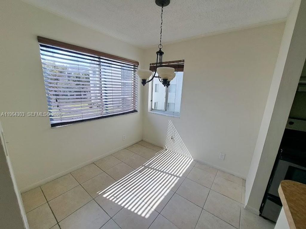 Photo of 5760 Rock Island Rd #327, Tamarac, FL 33319 (MLS # A11964303)