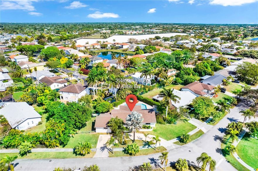 Welcome to the largest home in the subdivision, featuring a brand-new tile roof, fully remodeled pool and jacuzzi (2025), and shutters throughout, all set on an oversized 14,392 sqf lot. The 5/3 expansive house was completely remodeled in 2025, offering a modern, open layout with custom cabinetry, quartz countertops, stainless steel appliances, and updated bathrooms, including a convenient cabana bath. Step outside to a private backyard retreat where the resort-style pool and jacuzzi, enhanced by dramatic evening lighting, create the perfect space for entertaining or relaxing. The oversized lot provides rare privacy and flexibility within the community. Ideally located just 2 minutes from the Florida Turnpike and within walking distance of the upcoming Cutler Bay Government Center, featuring a community center, outdoor fitness circuit, splash pad, scenic canal overlook, community garden, and expansive green space—adding long-term lifestyle and value. This property stands out as a truly rare opportunity in Cutler Bay.