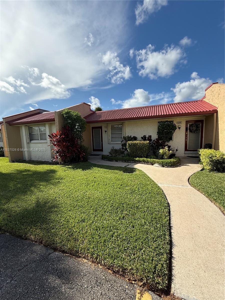 Unique opportunity! Rent a beautiful villa facing the lake, perfect for those seeking comfort and tranquility. Features a modern remodeled kitchen, spacious living area ideal for relaxing and entertaining, and laminate flooring that adds elegance. 2 bedrooms, 2 bathrooms, and accordion hurricane shutters providing both convenience and peace of mind. Located within the 24/7 guard-gated active adult community of Golden Lakes. Amenities include a community convenience of a courtesy bus, pool, fitness center, billiards, shuffleboard, tennis, classes, and events. The location further enhances this one-of-a-kind lifestyle, with easy access to shopping, dining, healthcare facilities, and the FL Turnpike. Downtown West Palm Beach, beaches, and PBI Airport are just minutes away. 55+ community
