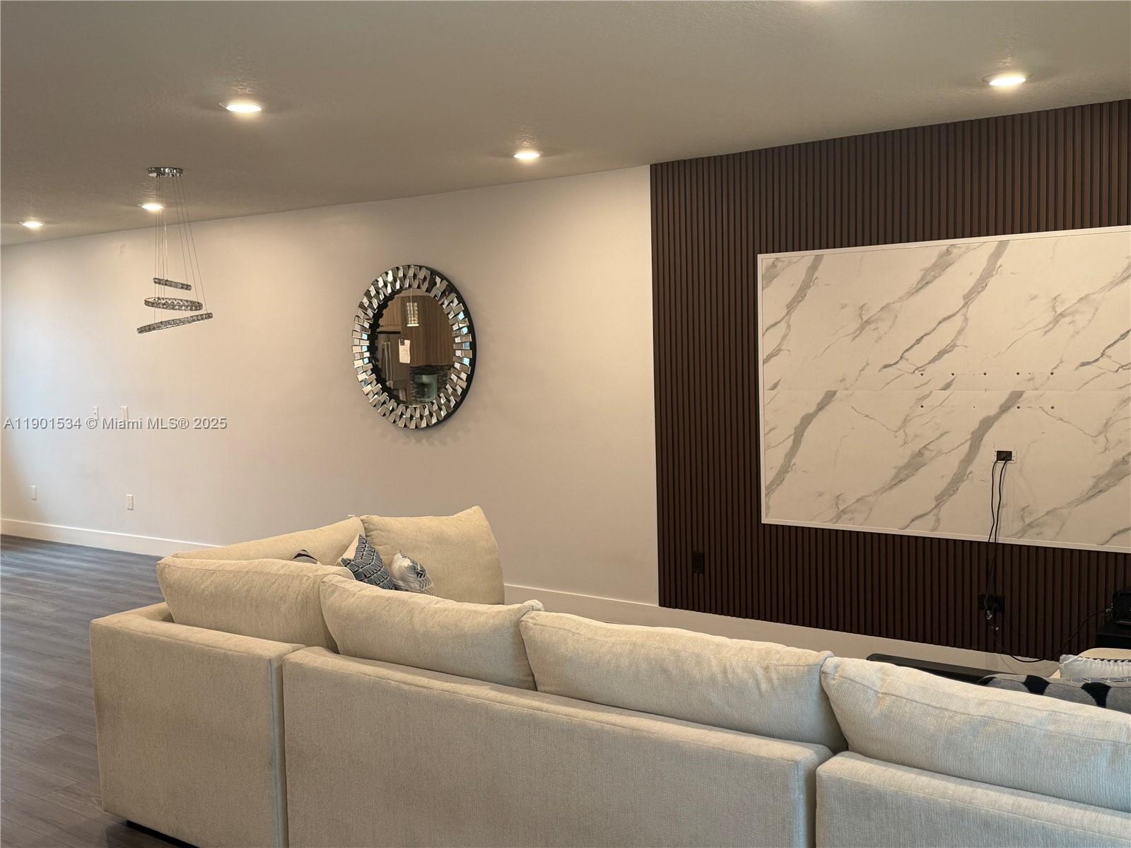 Welcome to this stunning listing at 10428 NW 67 St in the highly coveted Landmark Doral community. This immaculate property boasts 3 bedrooms and 2.5 baths. Located right across from the esteemed Doral International Academy of Math and Science, this property is situated in an unbeatable location. Upon entry, you'll be stunned by the impeccable condition of this home. From the carefully tiled garage to the abundant storage in each closet, every detail has been thoughtfully considered. The backyard has been elegantly upgraded, creating a space perfect for outdoor entertaining or simple relaxation. This property stands apart with incredibly low HOA fees of only $270/month