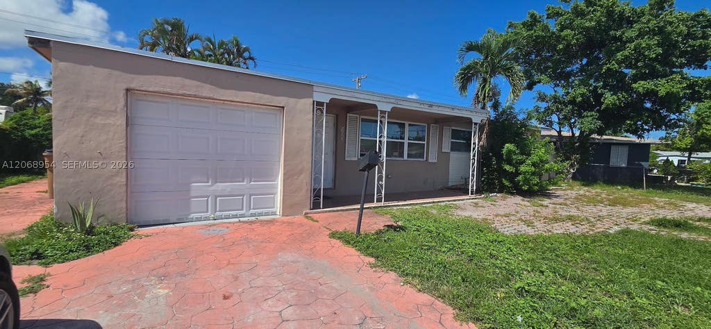 Photo of 601 W Sample Rd, Deerfield Beach, FL 33064 (MLS # A12068954)