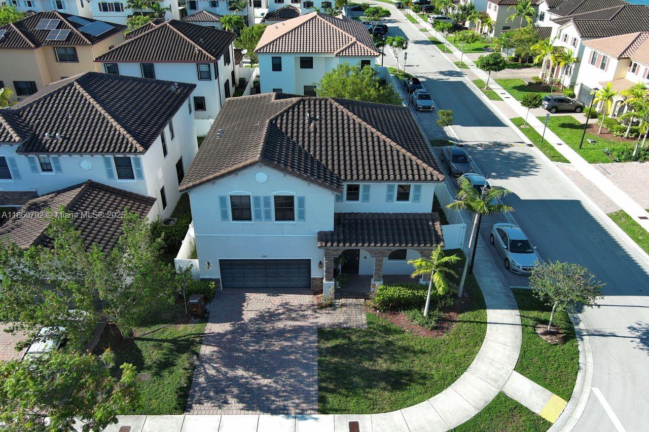 Welcome to this beautiful 2-story corner-lot home offering 2,800 sq ft of living space in one of Hialeah’s most desirable community BONTERRA. This residence features 4 spacious bedrooms, 2.5 bathrooms, and a layout designed for comfort and style. The main floor boasts ceramic tile throughout, while the second level features warm wood flooring. A 2-car garage plus 2 additional driveway spaces provide parking for up to 4 vehicles. The large backyard with a paved patio is ideal for entertaining family and friends. Located in a sought-after neighborhood with top-rated schools, this move-in ready home also offers access to community amenities including a pool and more. A true must-see! Conveniently located near I-75, Palmetto (826), Turnpike & 924.
