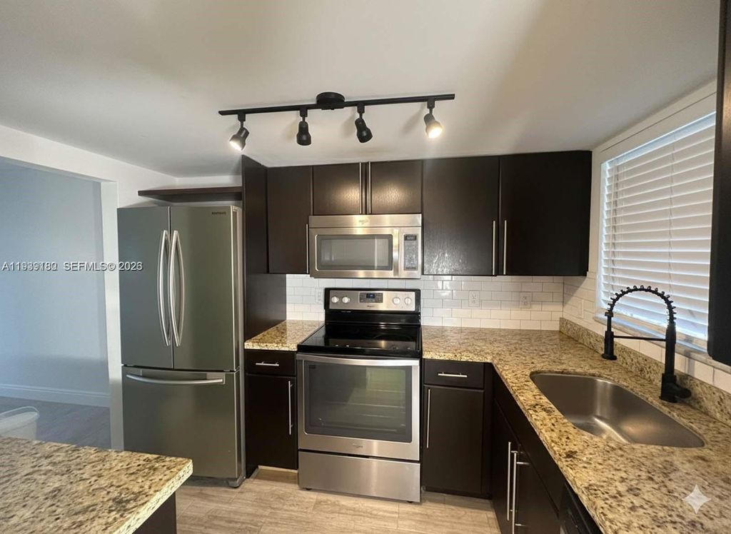 Photo of 1630 Embassy Dr #101, West Palm Beach, FL 33401 (MLS # A11939180)