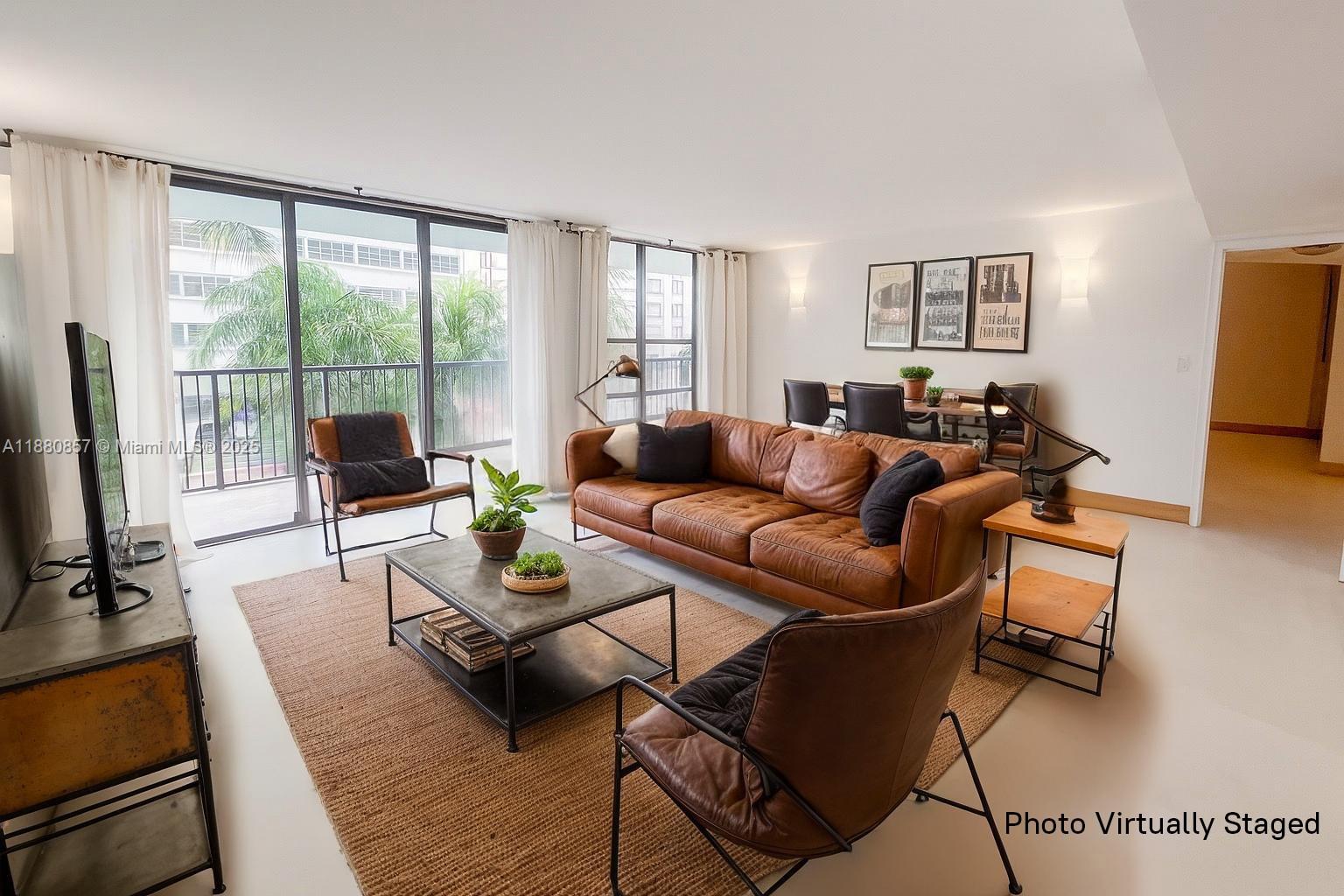 This 1,200 sq. ft. split-plan corner residence offers bright, open living with oversized windows that flood the Livingroom with natural light. A 225 sq. ft. balcony extends the home outdoors, ideal for relaxing or entertaining. Unit includes an open living/dining area, European-style kitchen, and a welcoming entryway with extra storage. The Master Bedroom boasts custom wardrobes and an en suite bath with step-in shower, while the second bedroom includes a walk-in closet and adjacent full bath.
Additional highlights: same-floor covered garage parking, HOA with internet and cable, and building amenities including an indoor pool. Located at 18th & Collins—just steps from the beachwalk and ocean—with the Botanical Garden, Convention Center, and Bass Museum all nearby.