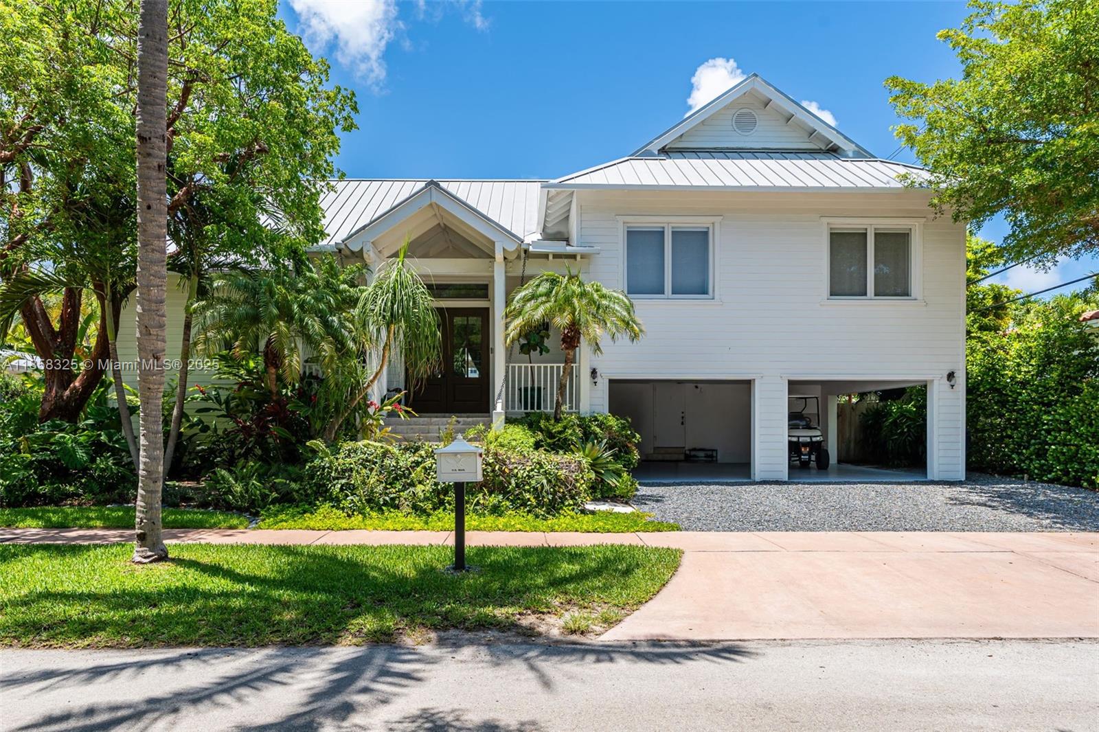 Stunning Key Biscayne beach-style residence, fully remodeled in 2022, blends warmth, comfort, and elegance. Expansive 3,933 SF under AC (per appraisal, larger than tax record) offers generous spaces for relaxed coastal living. Upstairs: 4 bedrooms, 3 full baths. Downstairs: 2 en-suite bedrooms with independent entrances plus a powder room. Open-concept layout showcases a chef’s kitchen, new summer kitchen with top appliances, formal living, separate dining, and a spacious family room. Large covered porch overlooks the pool and tropical landscaping, creating the ideal setting for indoor-outdoor living. Every detail has been meticulously crafted, marrying modern amenities with timeless Key Biscayne charm.