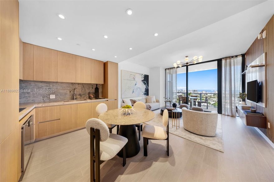 This sophisticated 1-bedroom, 1.5-bath residence at Five Park combines modern elegance with comfort and practicality. From the expansive terrace, take in panoramic views of the Atlantic Ocean and lively South Beach. Soaring 10-foot ceilings, floor-to-ceiling windows, and an open layout create an airy, light-filled ambiance. The chef’s kitchen is appointed with Gaggenau appliances, custom white oak cabinetry, and quartzite countertops. The primary bath showcases marble flooring, walls, and vanity. Five Park—Miami Beach’s newest luxury icon—offers residents an unparalleled lifestyle with premier amenities, including a bayfront full-service pool deck, cutting-edge fitness and wellness center, and an exclusive private beach club. Beatifully furnished
