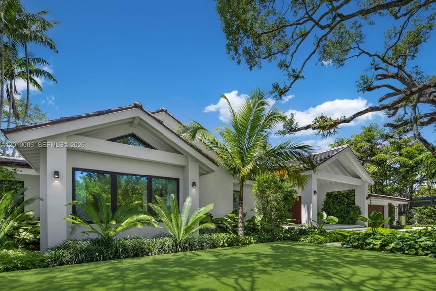 Reimagined and completed in 2024 this custom home designed by Pacheco Architecture is an exceptional single-story contemporary build on a 19,174 SF lot fronting the Riviera Golf Course in Coral Gables. 4,420 SF residence offers 4 bedrooms, 3.5 baths finished to an exacting standard. Volume ceilings and impact-rated windows and doors bathe the living areas in natural light, while White French Oak floors and Lapitec Sintered Stone surfaces establish a refined, cohesive aesthetic throughout. The chef's kitchen is appointed with a Wolf 8-burner gas range and double oven, dual SubZero refrigeration and refrigerator drawers, 2 Cove dishwashers, and a Wolf built-in coffee maker. A covered loggia connects the living spaces to resort-style outdoor grounds showcasing a Wolf summer kitchen, a heated saltwater pool with Diamond Brite finish, and manicured landscaping with mature trees and lush artificial turf. Lutron and Control4 fully integrate lighting, shading, and whole-house audio. Additional highlights include a whole-house water filtration system, 90-bottle wine fridge, home gym, two-car attached garage with dual EV charging, and a keypad-gated motor court that fits up to 8 cars. A distinguished expression of contemporary luxury on one of Coral Gables' most coveted golf course addresses.