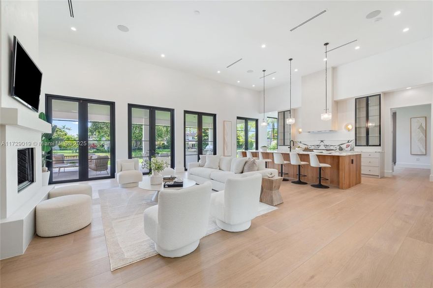 Exquisite Pinecrest residence just completed! This contemporary modern farmhouse is one of a kind sitting on a quiet dead-end street with canal on 2 sides. Integrating a seamless indoor/outdoor living experience with natural white oak wood floors which blend the immaculate architecture & expressive details. With 6,389 SF this home includes 4 full bedrooms plus an office downstairs, 1 bedroom upstairs plus a flex space which can be used as a guest quarters, gym, office and/or home theater. 5.5 bathrooms inside main home plus full cabana bath. Must see it in person to appreciate! 2 car garage with lift space.