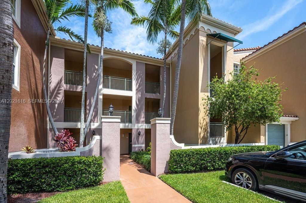 Photo of 11780 Saint Andrews Pl #208, Wellington, FL 33414 (MLS # A12021616)