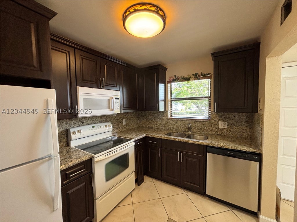 Photo of 21909 Lake Forest Cir #205, Boca Raton, FL 33433 (MLS # A12044949)