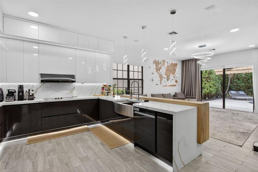 A rare opportunity to own a fully renovated single-story residence in Parkland, thoughtfully redesigned with quality craftsmanship and refined finishes throughout. This desirable split-bedroom floor plan features complete hurricane-impact windows and doors for added protection and efficiency.
The home has undergone an extensive renovation with carefully selected materials and custom details. Interior highlights include a custom-built wine cellar, designer wall panels, bespoke cabinetry, and a beautifully appointed kitchen with new appliances. The spacious primary suite offers an oversized walk-in closet and a well-designed bathroom featuring smart technology toilets with remote-control functionality. A whole-house water filtration system and integrated smart home features compatible with Alexa and Apple devices enhance everyday comfort and convenience.
The fully fenced backyard is surrounded by mature trees, creating a private outdoor setting. Recent exterior upgrades include new tile installation, ambient landscape lighting, and a heated saltwater pool. The outdoor space is well suited for both relaxing and entertaining.
Low HOA. Non-gated community. Conveniently located within walking distance to Heron Heights Elementary School and close to parks, shopping, and dining options.
Move-in ready.