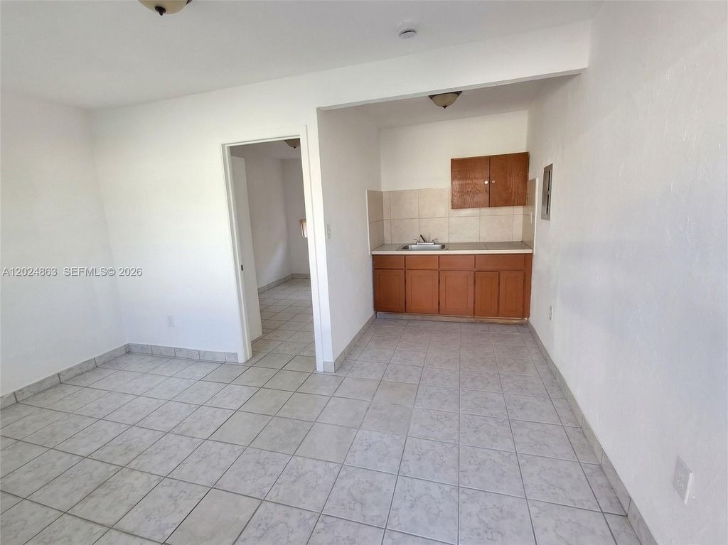 Photo of 625 W Avenue A, Belle Glade, FL 33430 (MLS # A12024863)