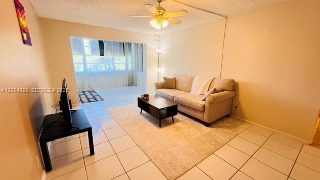 Photo of 6500 Cypress Rd #402, Plantation, FL 33317 (MLS # A12004328)