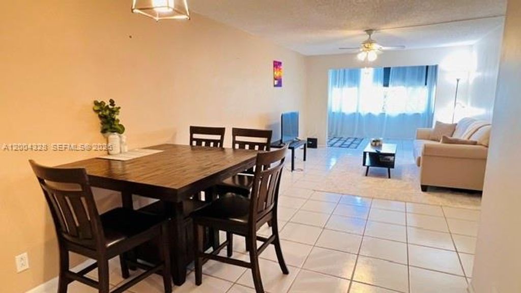 Photo of 6500 Cypress Rd #402, Plantation, FL 33317 (MLS # A12004328)