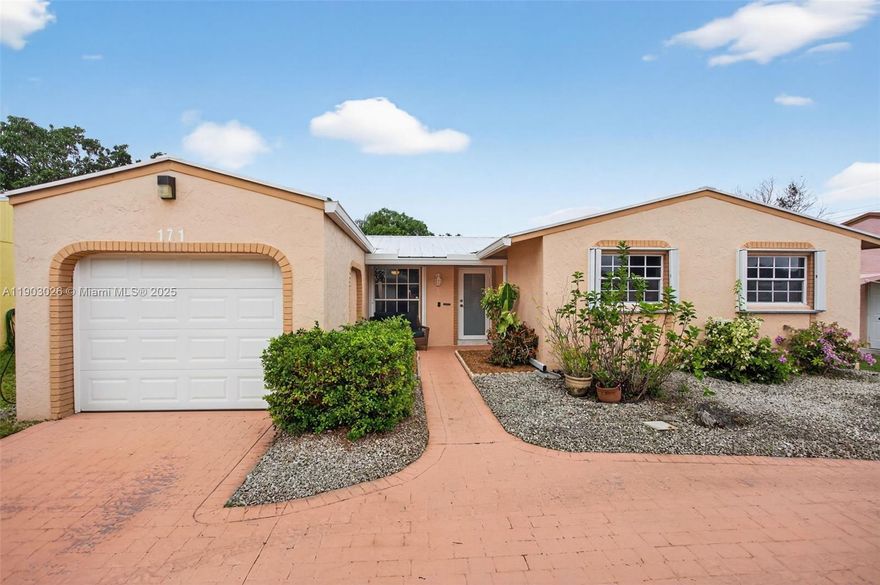Move-in Ready 3-bedroom, 2-bath single-family home with no HOA!
If you’re looking for a solid home with big-ticket items already done, then this is the home for you. A 2022 metal roof, impact front door, accordion shutters, and storm doors on the back and garage provides full hurricane protection and peace of mind.  Inside, the kitchen features granite countertops, a 2022 induction stove, 2024 dishwasher, and a 2024 hybrid water heater that helps keep energy costs low. The primary bathroom was fully remodeled in 2024, while the second bathroom includes a new vanity and new bathtub. Additional updates include new toilets, a 2022 washer and dryer, 2020 A/C and a Tesla car charger. The garage has been converted, providing extra storage space. Schedule your showing today!