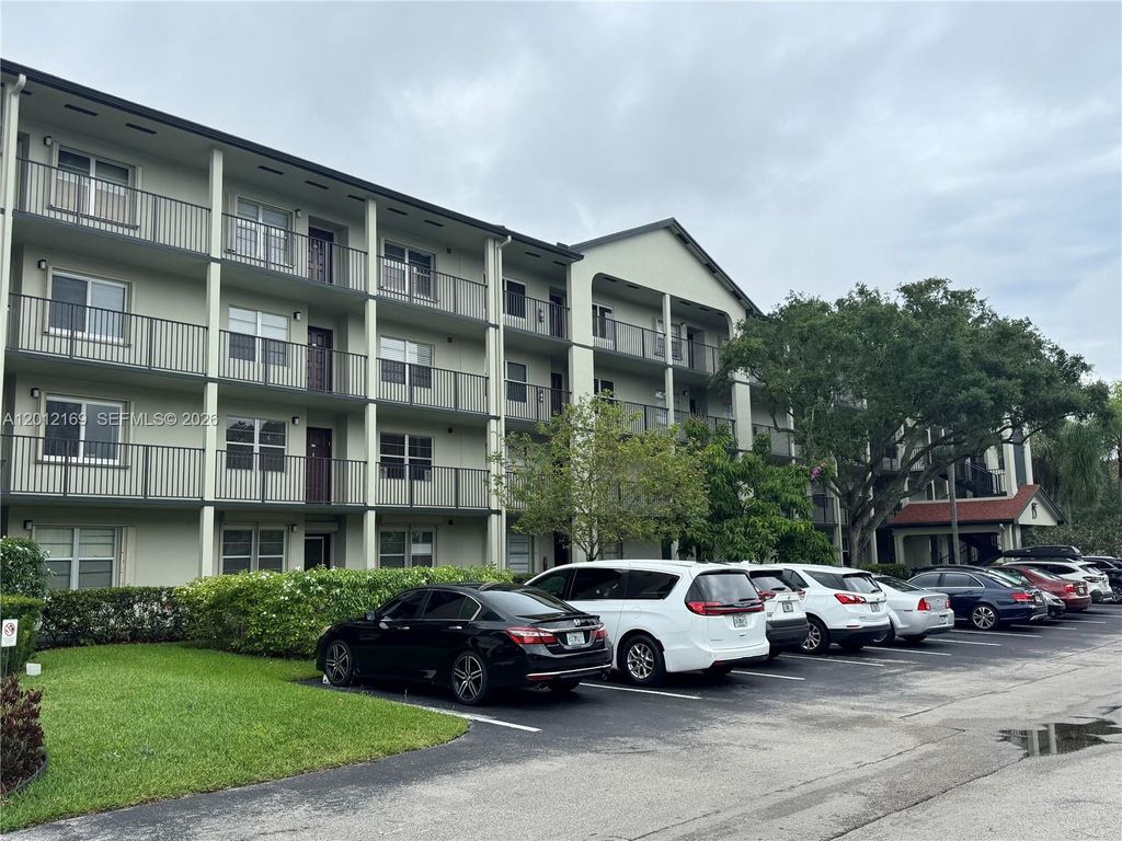 Photo of 12950 SW 13th St #412D, Pembroke Pines, FL 33027 (MLS # A12012169)
